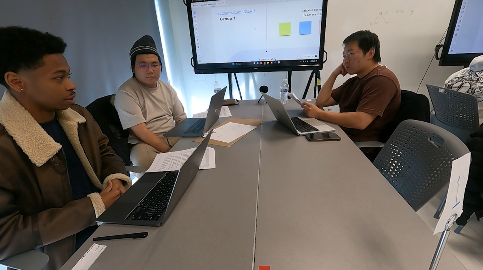 The bottom image showcases the traditional view. Three students, two farther from the camera and one near-left to the camera. This is the group with three students.